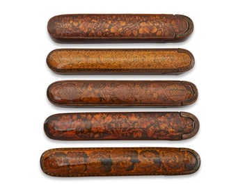 A group of Persian polychrome wood and papier-m‚che pen boxes