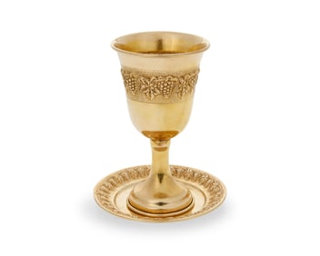A 14k gold Kiddush cup and saucer
