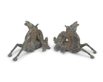 A pair of bronze hippocampus fountains