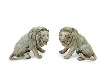 A pair of large bronze figures of lions
