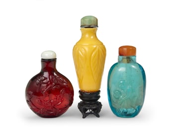 Three Chinese carved glass snuff bottles