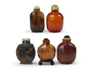 Five Chinese carved stone snuff bottles