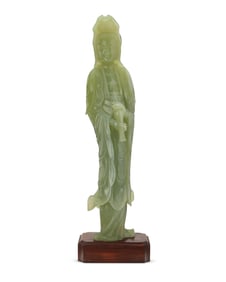 A Chinese carved jade figure of Guanyin