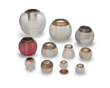 A group of sterling silver and glass match strikes