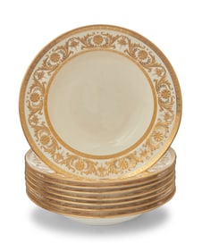 A set of eight Mintons gilt porcelain soup bowls