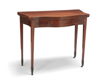 A George III mahogany fold-over games table