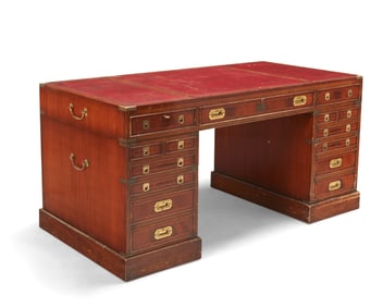 An English campaign-style brass-mounted mahogany pedestal desk