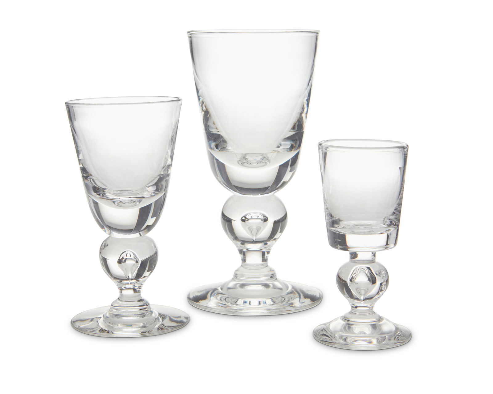 A Steuben glass 'Baluster' stemware service: A Steuben glass 'Baluster' stemware serviceLate 20th centuryEach with etched Steuben script mark; Box marked: Steuben Showroom / Bullock's WilshirePattern 7877, comprising 12 caret wine glasses (5.75"