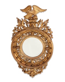 A Classical Revival giltwood convex mirror
