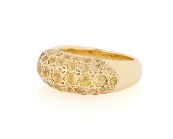 An 18K Gold and Yellow Sapphire Ring