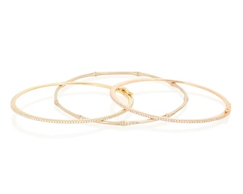 A Group of Three 18K Bi-Color Gold and Diamond Bangles