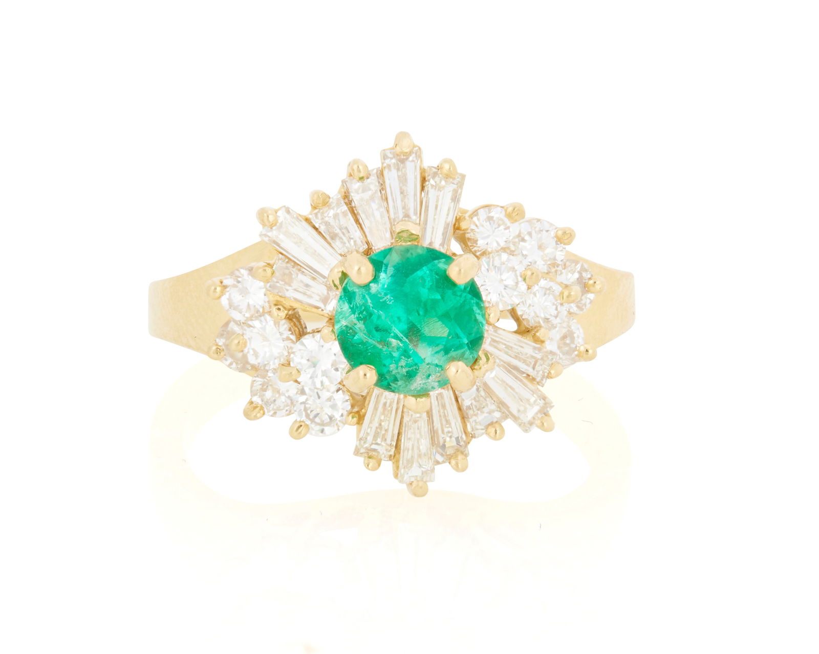 An 18K Gold, Emerald and Diamond Ring: An 18K Gold, Emerald and Diamond RingCentering a round emerald weighing approximately 0.95 carat, accented by round and baguette diamonds weighing approximately 0.72 caratSize: 6 1/45.8 grams gross