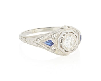 An 18K White Gold, Diamond and Synthetic Sapphire Ring