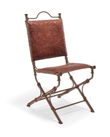 A Western-style tooled leather and wrought iron chair