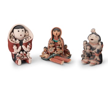 A group of Southwest Pueblo pottery storytellers