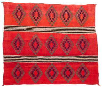 A Navajo Transitional woman's wearing blanket