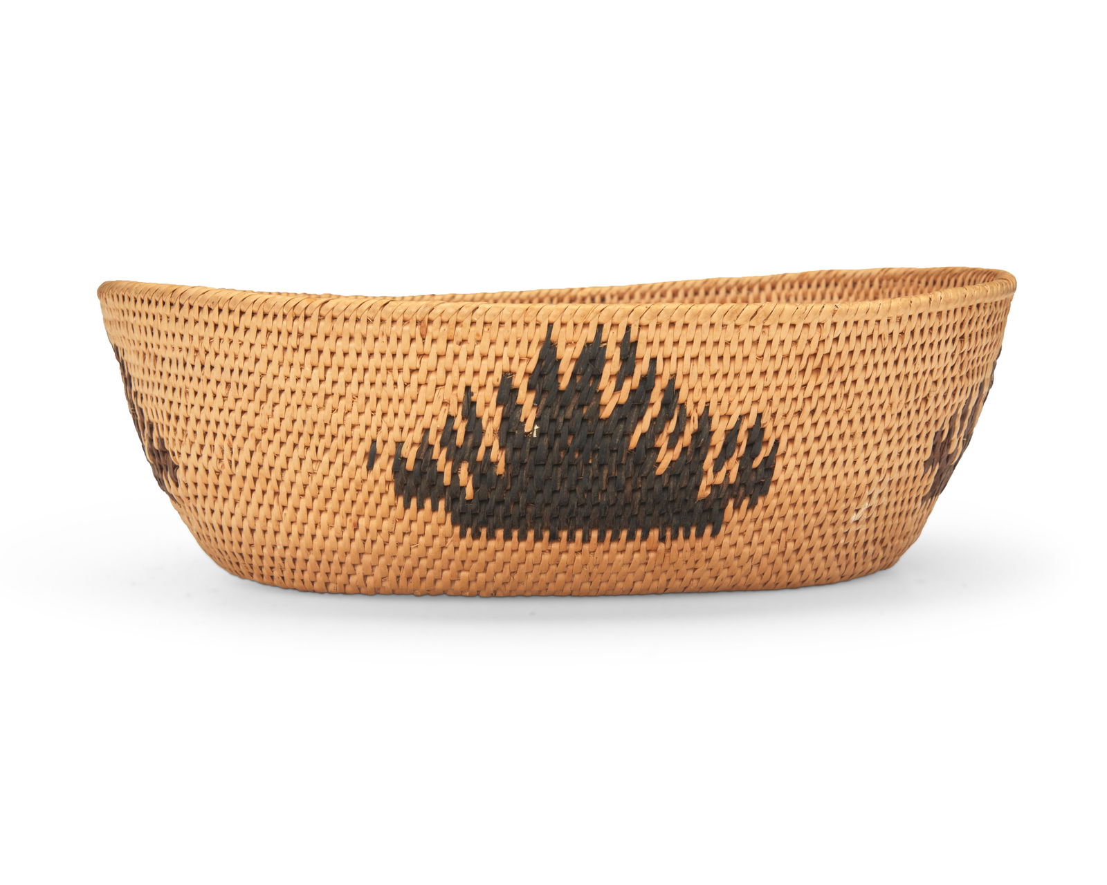 A polychrome Washoe basketry bowl: A polychrome Washoe basketry bowlEarly/mid-20th century; Northern California/NevadaA coiled oval low bowl with four irregular sawtooth or flame motifs in black and in brown.2.75" H x 8.75" W x 7" D Th