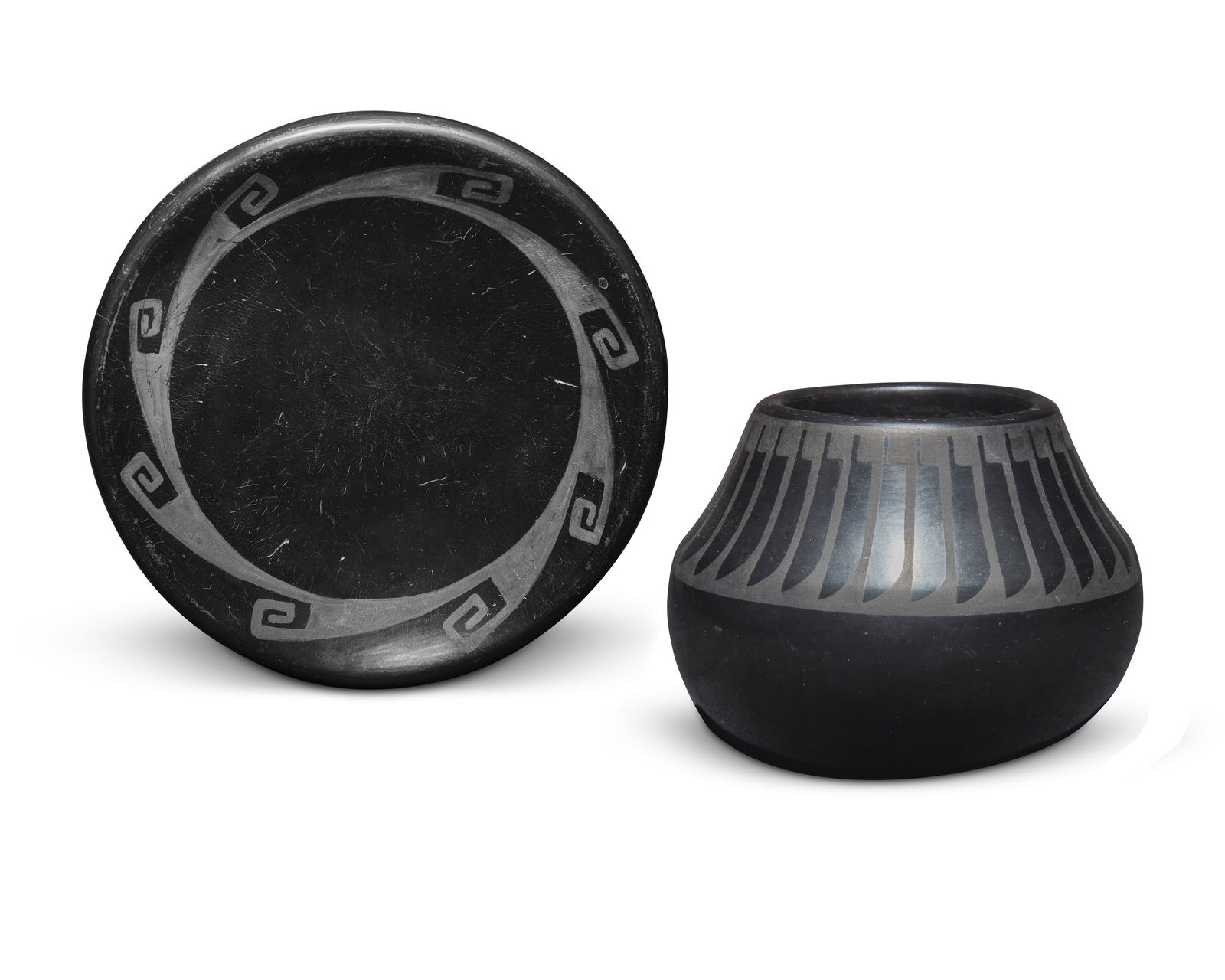 Maria Martinez & Popovi Da (1887-1980 & 1923-1971, San Ildefonso Pueblo), Two blackware pottery: Maria Martinez & Popovi Da (1887-1980 & 1923-1971, San Ildefonso Pueblo)Two blackware pottery vessels, mid-20th centuryEach incised to underside: Maria / PopoviEach with black on black designs, compri