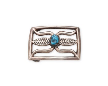 A Wilford J. Henry Navajo cast silver and turquoise belt buckle