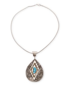 A Tony Aguilar Sr. Kewa sterling silver and turquoise pendant necklace