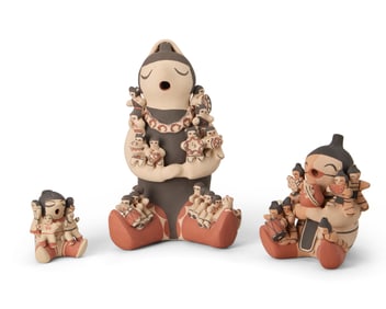 A group of Southwest Pueblo pottery storyteller figures