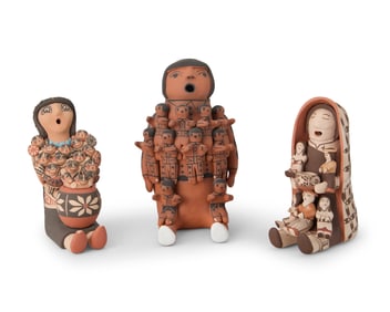 A group of Southwest Pueblo pottery storyteller figures