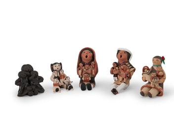 A group of Southwest Pueblo pottery storyteller figures