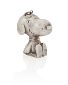 Cartier: A Silver Snoopy Pendant and Signed Book