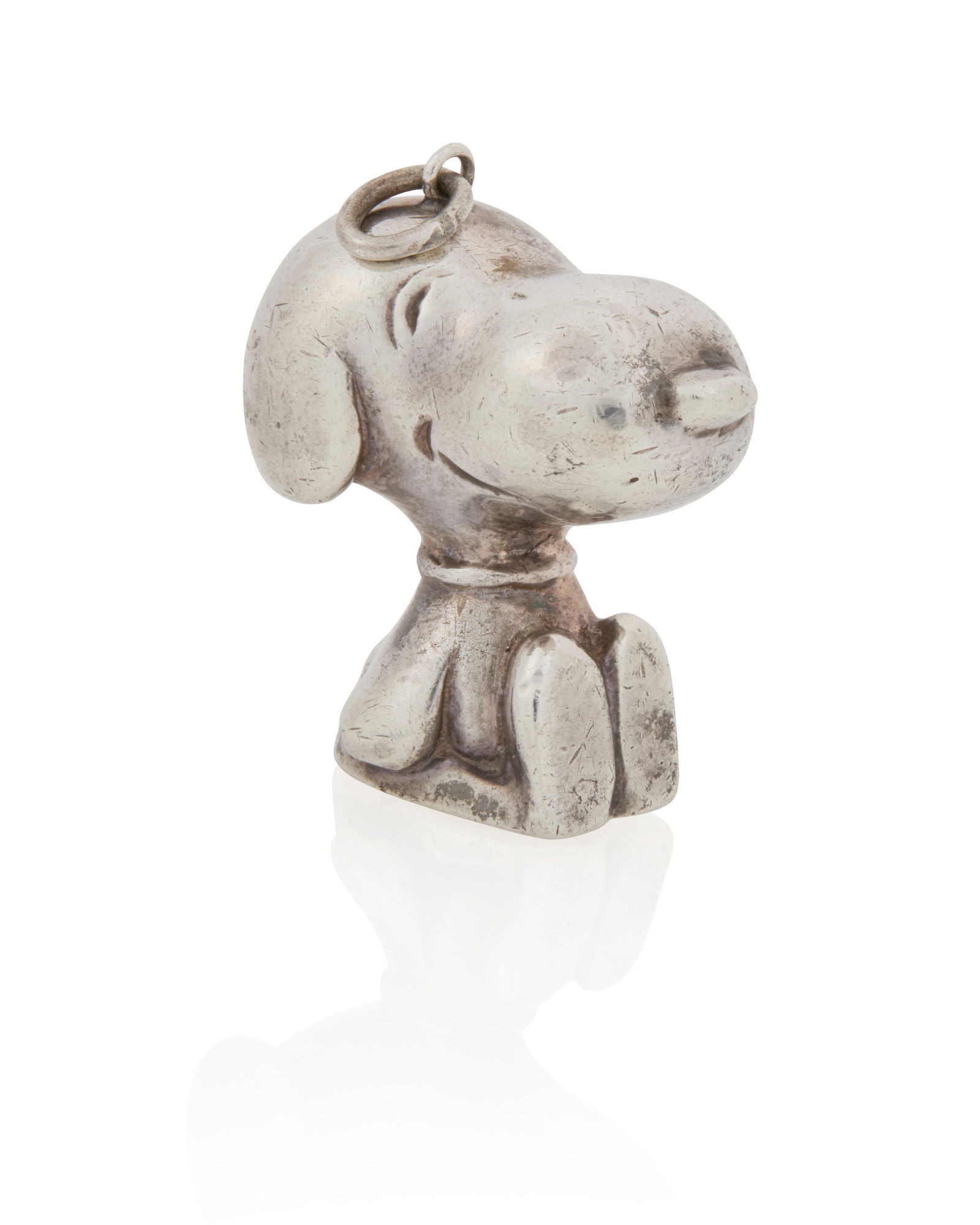 Cartier: A Silver Snoopy Pendant and Signed Book (1 of 7)