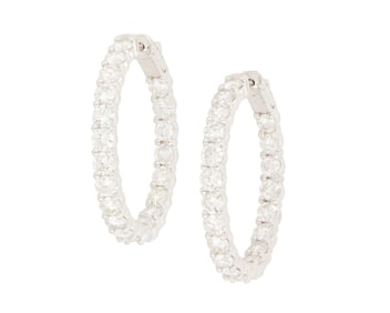 A Pair of 14K White Gold and Diamond Hoop Earrings