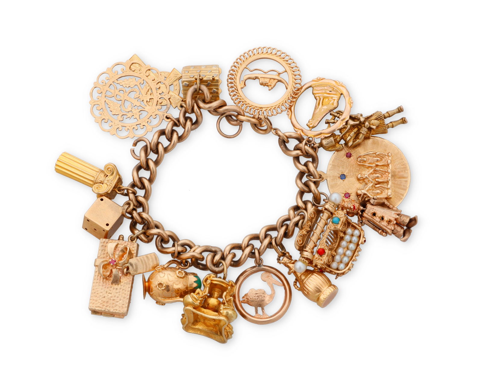 A Gold and Gem-Set Charm Bracelet: A Gold and Gem-Set Charm BraceletSuspending sixteen charms featuring a gem-set typewriter, 'hear no see no speak no evil monkeys', a clown and houseLength: 7 in., Charms: 1/2 - 1 3/8 in. 114.9 grams g