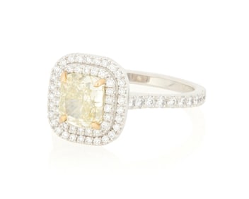 An 18K Bi-Color Gold, Fancy Yellow Diamond and Diamond Ring