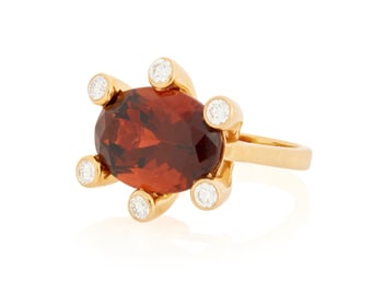 An 18K Gold, Garnet and Diamond Ring