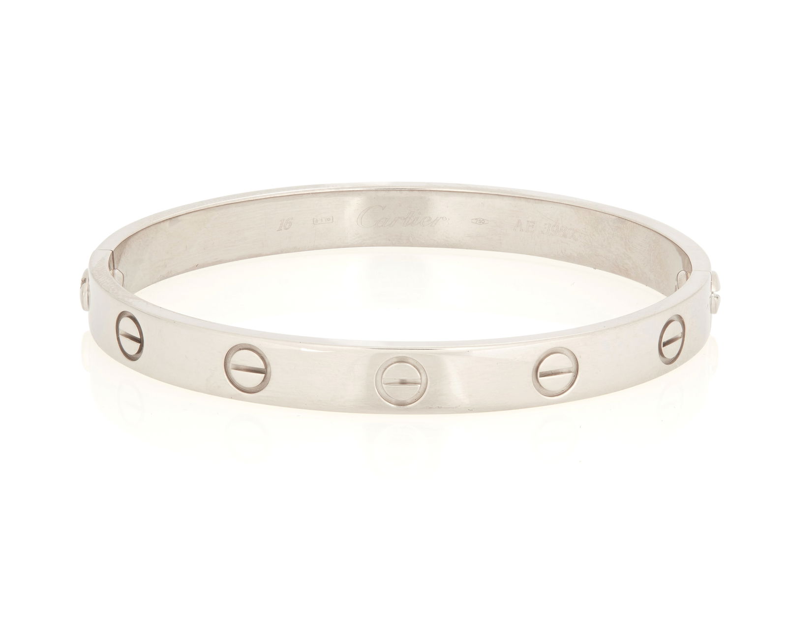 Cartier: An 18K White Gold 'Love' Bracelet: Cartier: An 18K White Gold 'Love' BraceletFeaturing two screw point openings with additional crew motifs, signed Cartier, 1993 no. AE3980, 16, with original white screwdriver and boxSize: 6 in.30.3 gr