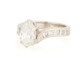 A 14K White Gold and Diamond Ring