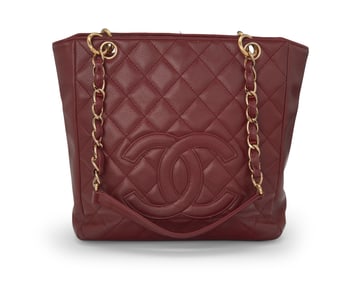 CHANEL: A Dark Red Caviar Leather Petit Shopping Tote, 2004-2005