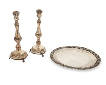 A pair of sterling silver candlesticks and an oval tray