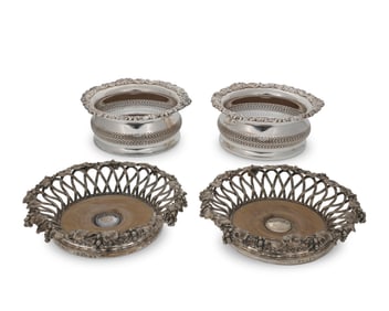 Two pairs of silver-plated wine bottle coasters
