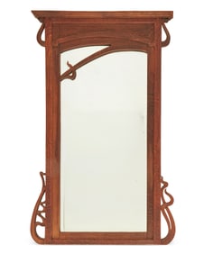 An Art Nouveau carved wood mirror