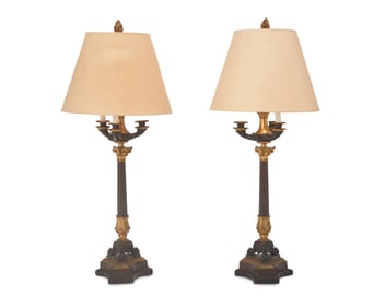 A pair of Empire-style gilt and patinated bronze table lamps