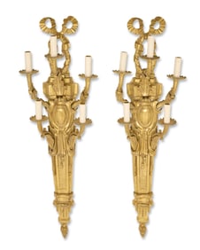 A pair of Louis XVI-style gilt-bronze wall sconces
