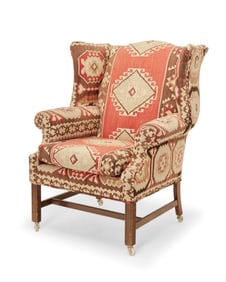 A George III-style wingback armchair