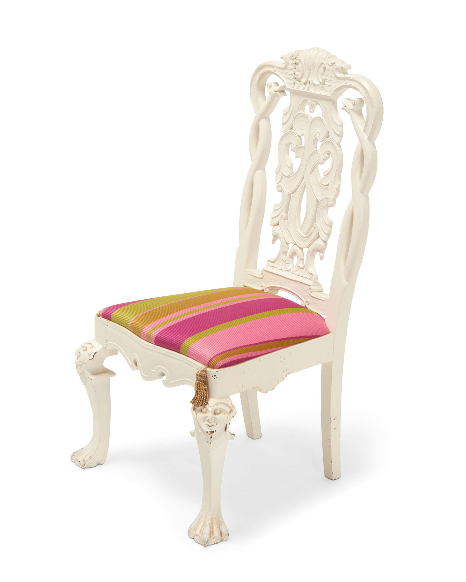 A Dutch Rococo-style side chair: A Dutch Rococo-style side chair20th centuryThe white painted carved wood frame with openwork seatback featuring bird-form figural and scrolled motifs, above a later fabric upholstered seat cushion wit