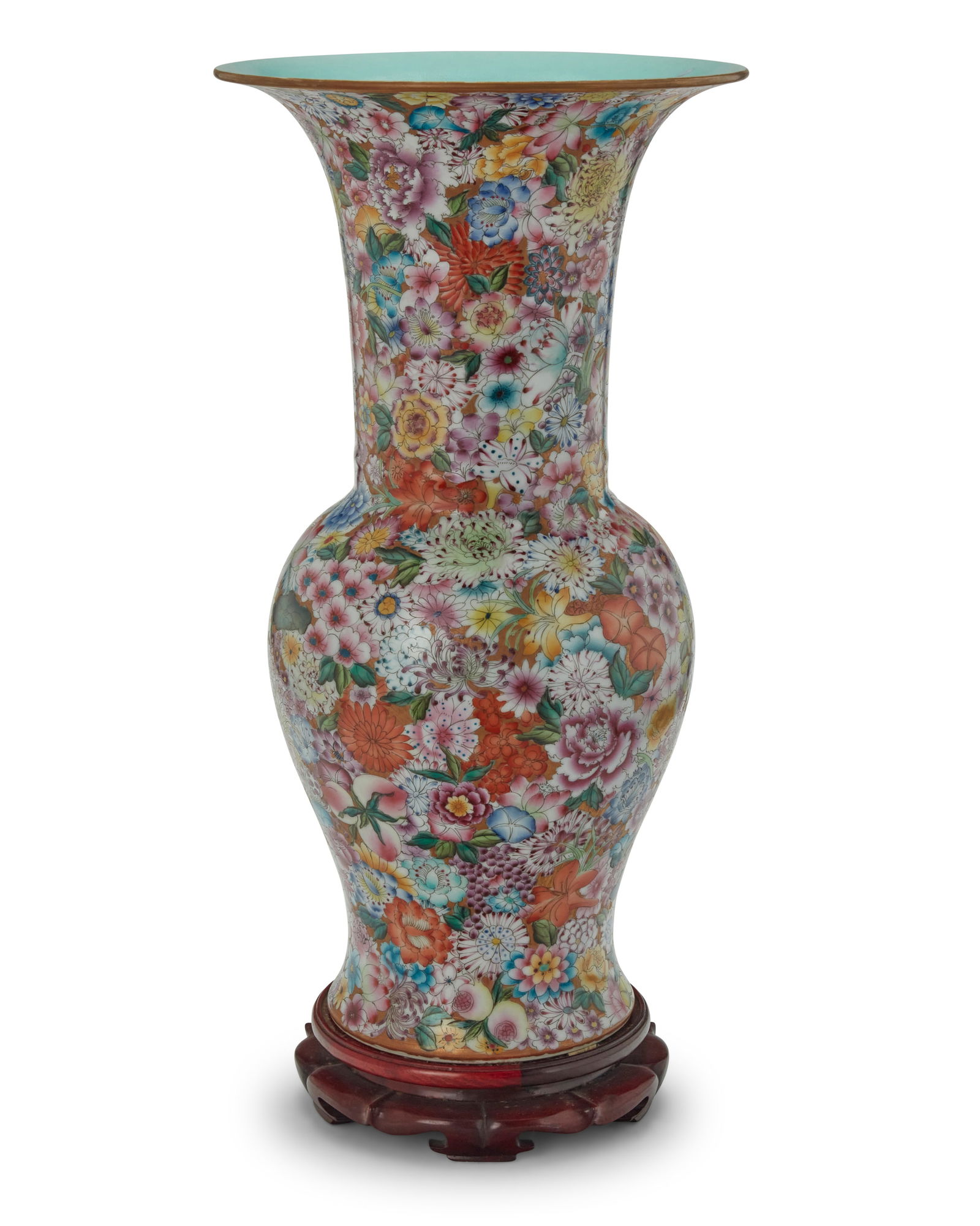 A Chinese porcelain millefleurs vase: A Chinese porcelain millefleurs vase20th centuryBearing an apocryphal reign mark for Qianlong Period (1736-1795)The baluster-form vase with wide flared rim, profusely decorated in floral motifs, set o