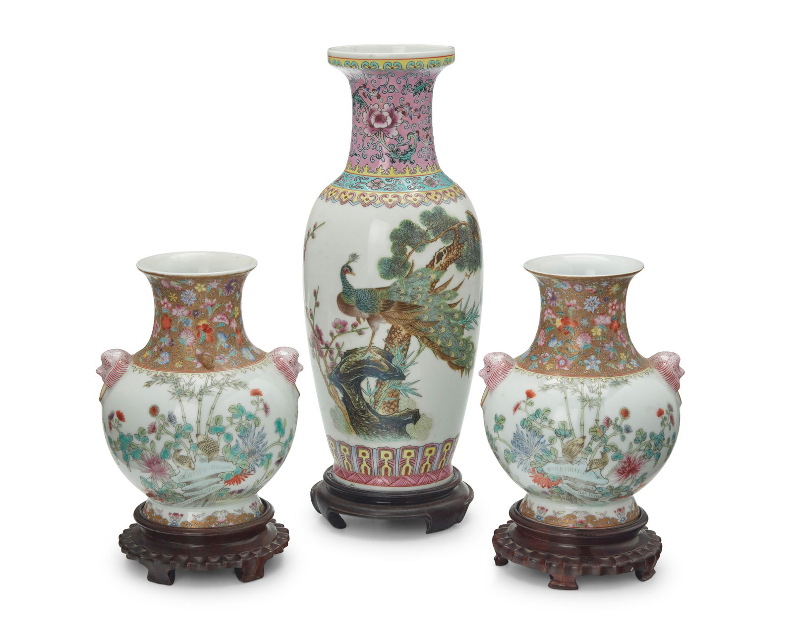 Three Chinese Famille Rose porcelain vases: Three Chinese Famille Rose porcelain vases20th centuryEach bearing an apocryphal reign mark for Qianlong Period (1735-1796); The tallest with Chinese inscription to bodyComprising a tall vase and a pa