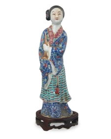 A Chinese polychrome porcelain figure of a beauty