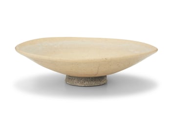 An Asian-style pale yellow glazed ceramic bowl