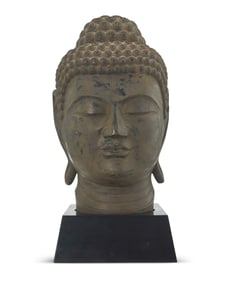 An Asian-style carved wood head of Buddha