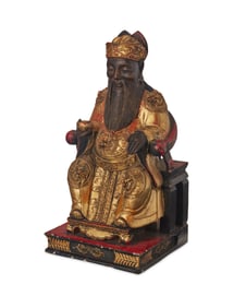 An Asian carved wood figure of Baosheng Dadi