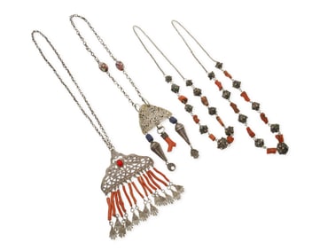 A group of vintage coral and silver tribal-style necklaces